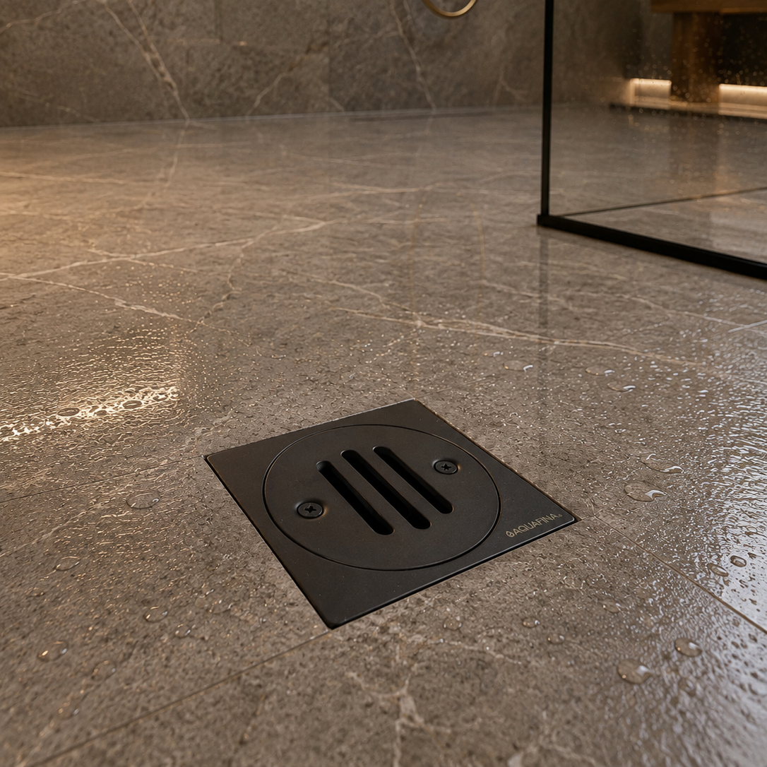 Desagüe para piso cuadrado 4" x 4" sencillo en acero inoxidable negro